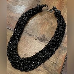 Black beaded bib necklace with adjustable clasp